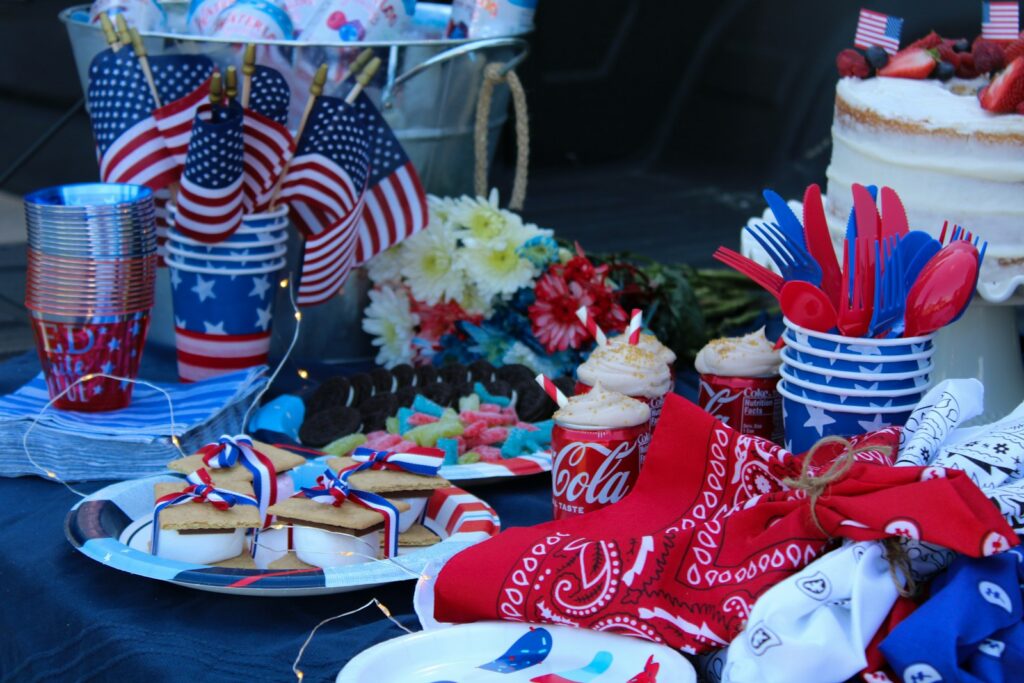 a table with food and flags for 4th of July celebration