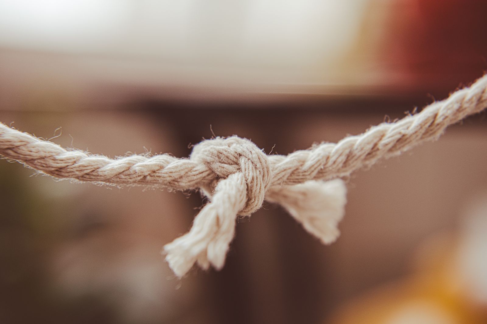 Three intertwined rope strands tied together, symbolizing the meaning of “a threefold cord is not easily broken” in Ecclesiastes 4:12.