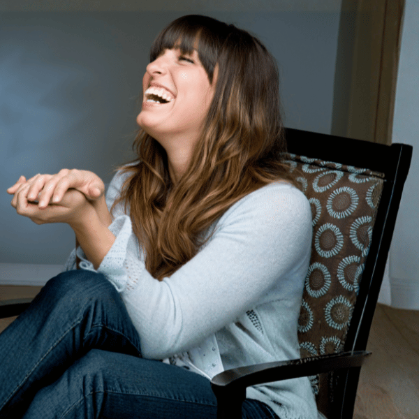 Woman laughing to depict fun and humor