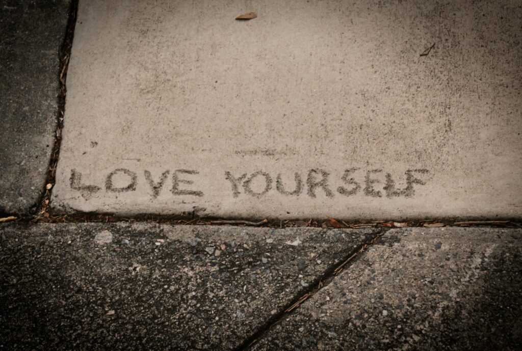 short self-love text on concrete