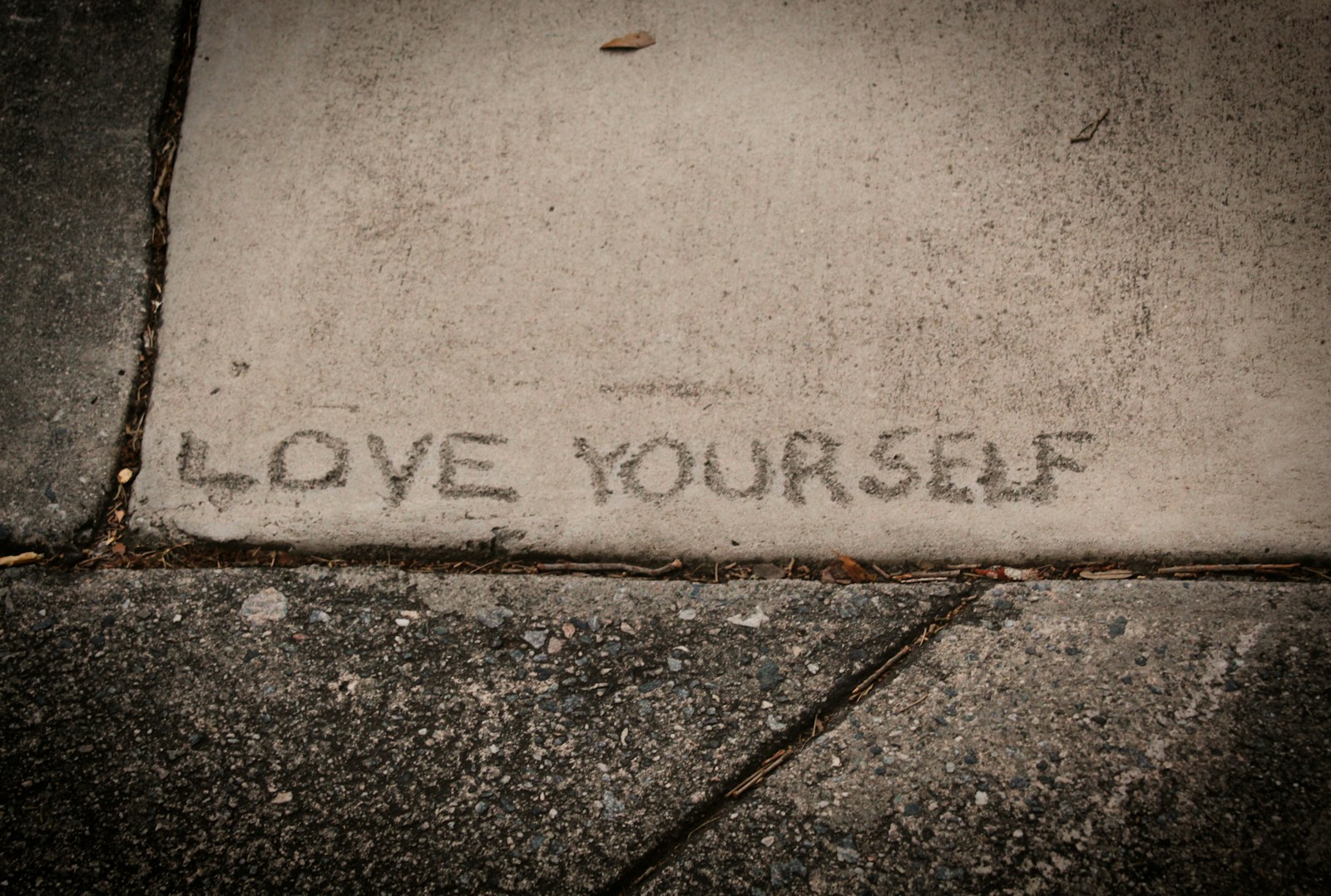 short self-love text on concrete