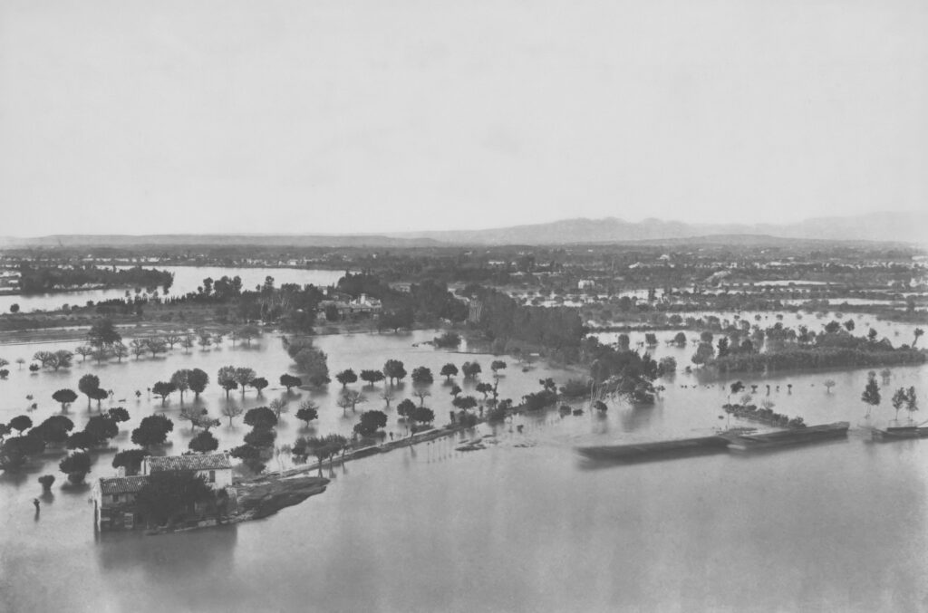 Historic flooded landscape with submerged homes and trees, illustrating the biblical days of Noah.