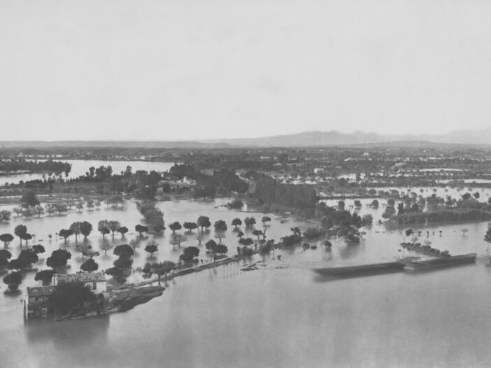 Historic flooded landscape with submerged homes and trees, illustrating the biblical days of Noah.