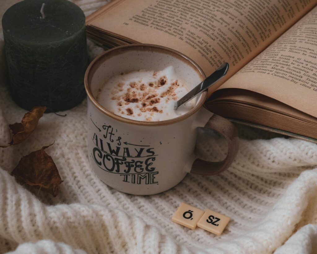 Cozy coffee, books and autumn leaves