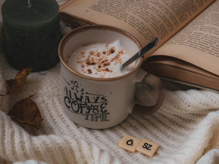 Cozy coffee, books and autumn leaves