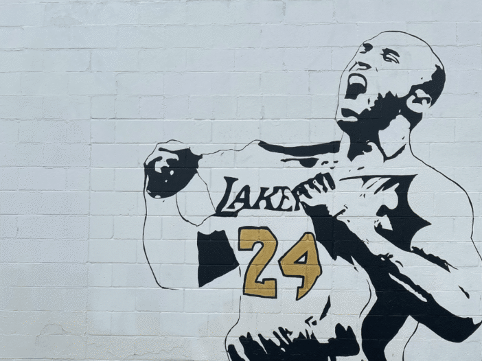 Black-and-white Kobe Bryant mural wearing a Lakers number 24 jersey.