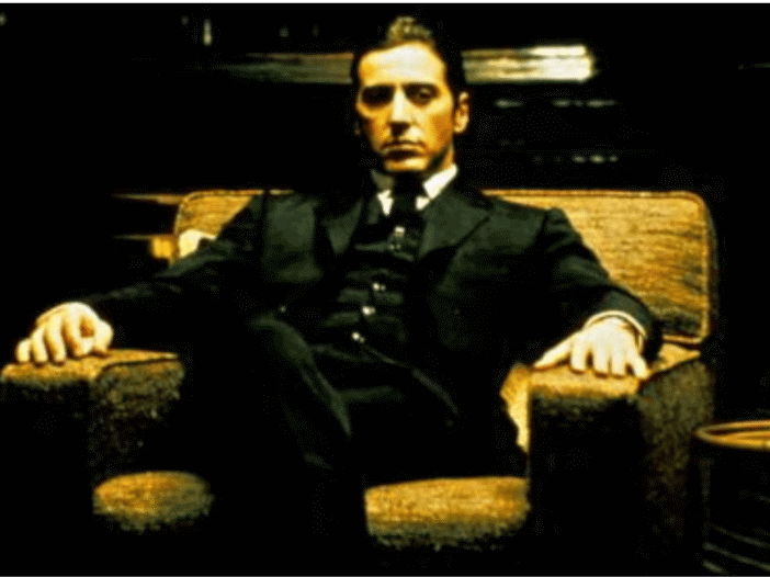 Al Pacino as Michael Corleone seated in The Godfather Part II
