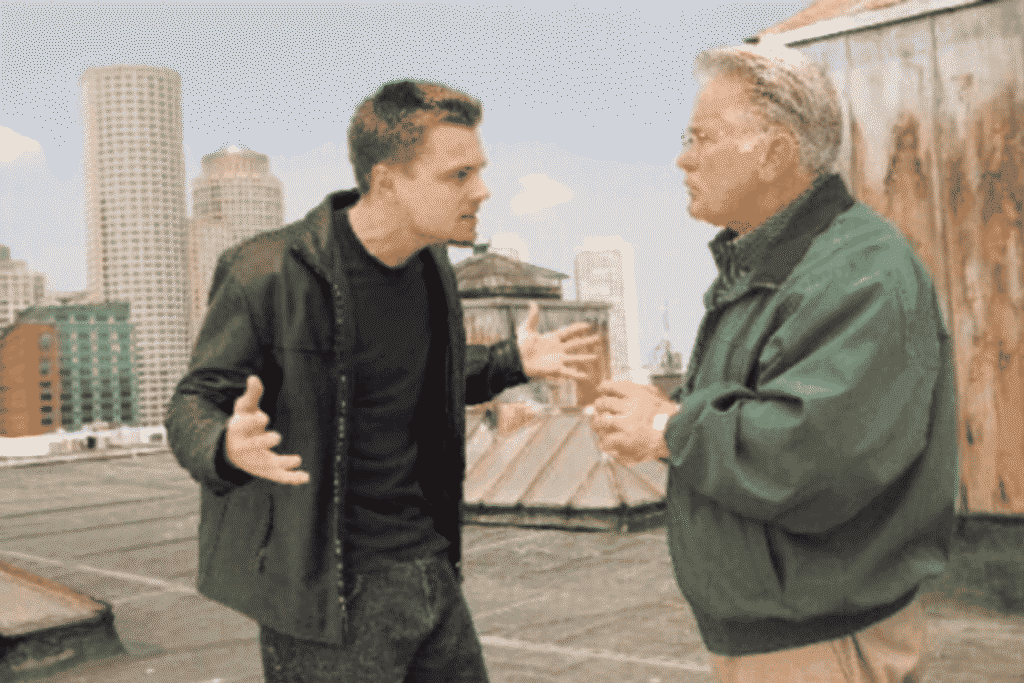 Leonardo DiCaprio speaks with director Martin Scorsese on the set of The Departed