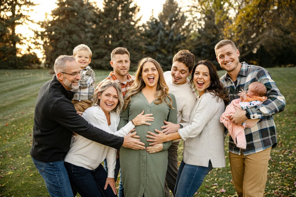 Multigenerational family laughing together outdoors, reflecting the love celebrated in family quotes from books.