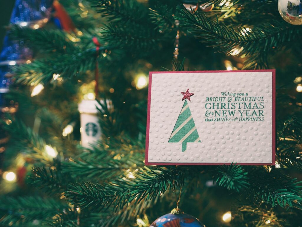 Christmas and New Year card on a Christmas tree, perfect for sharing Christmas verses