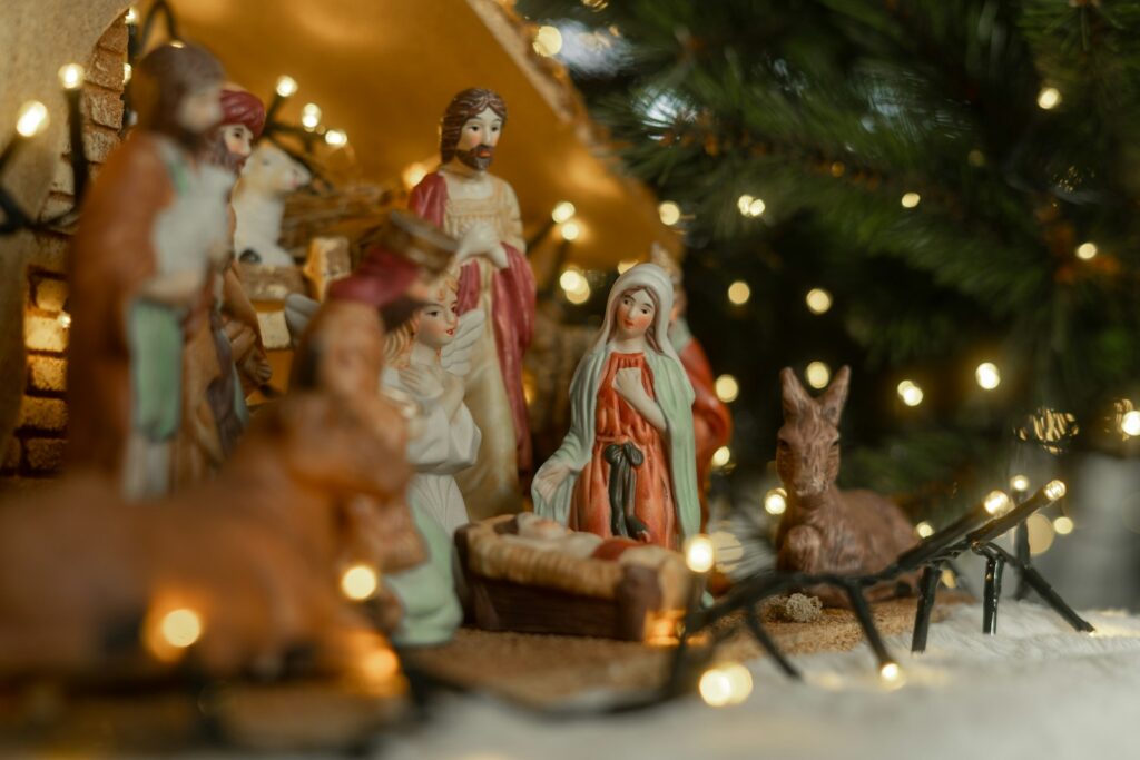 Christmas nativity scene with figurines and lights, to illustrate Christmas bible verses
