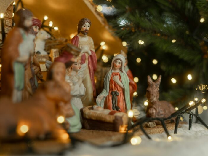 Christmas nativity scene with figurines and lights, to illustrate Christmas bible verses