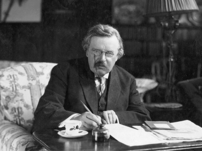G. K. Chesterton at work on his desk