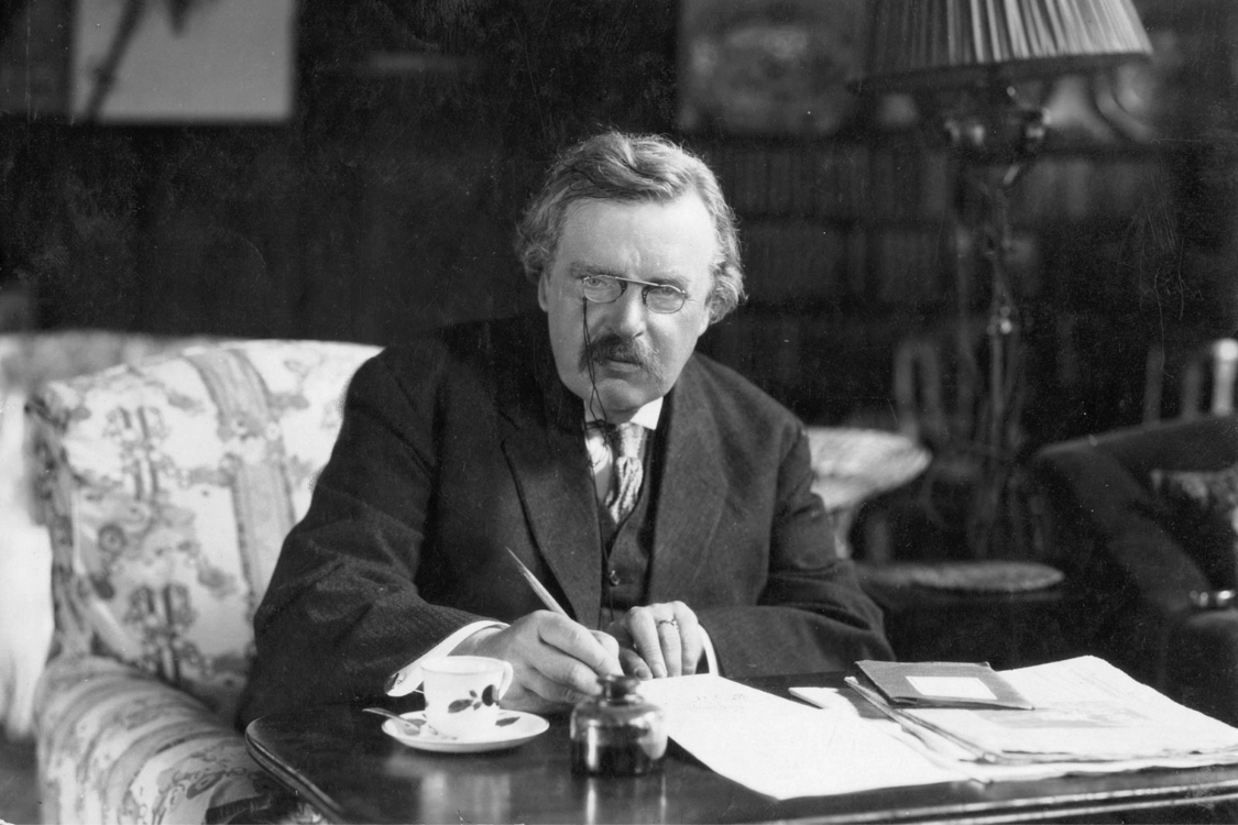 G. K. Chesterton at work on his desk