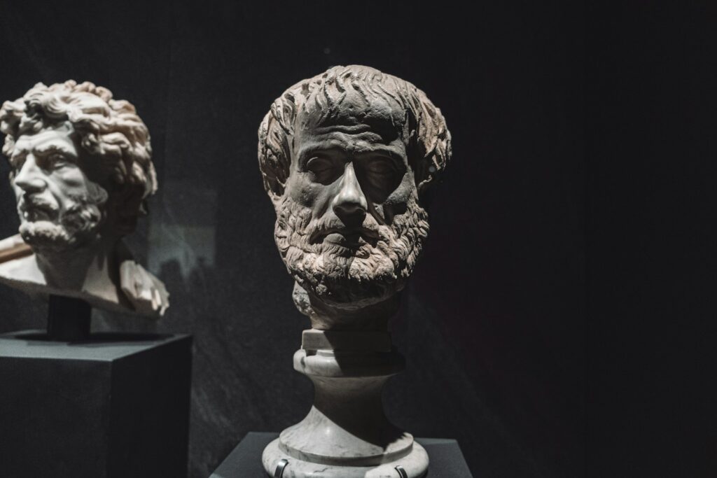 Bust of the Greek philosopher Aristotle, accompanying famous Aristotle quotes and their meanings.