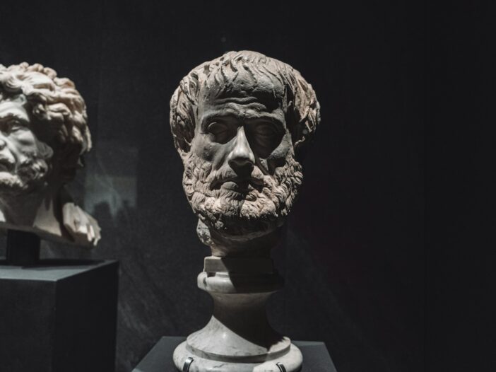 Bust of the Greek philosopher Aristotle, accompanying famous Aristotle quotes and their meanings.